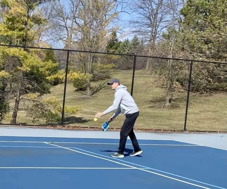 a person playing Pickleball while remembring Pickleball Kitchen Rule